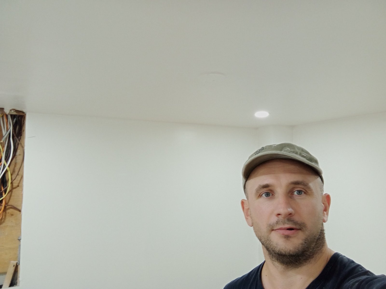 Owner on site after finishing a drywall and ceiling repair