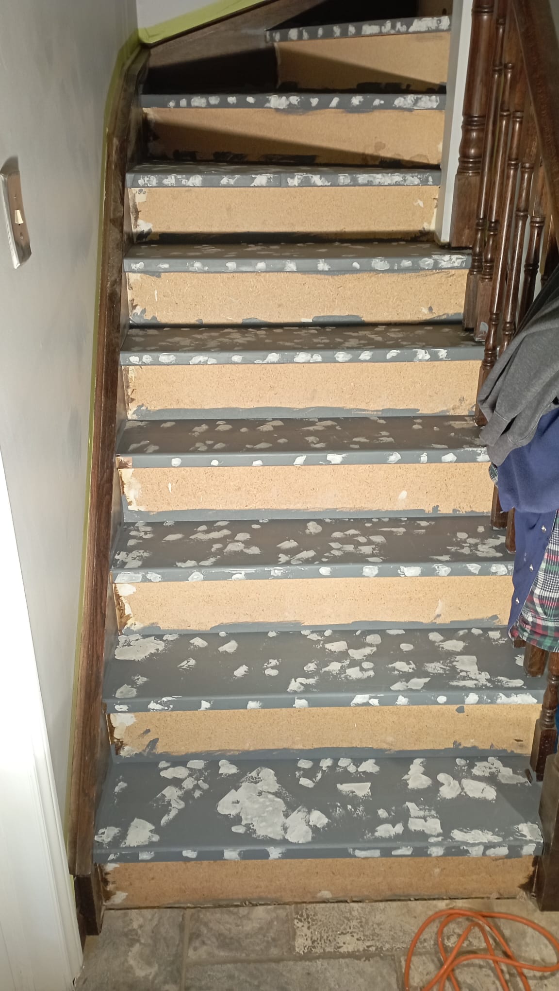Interior staircase stripped of old finish and patched, ready for paint