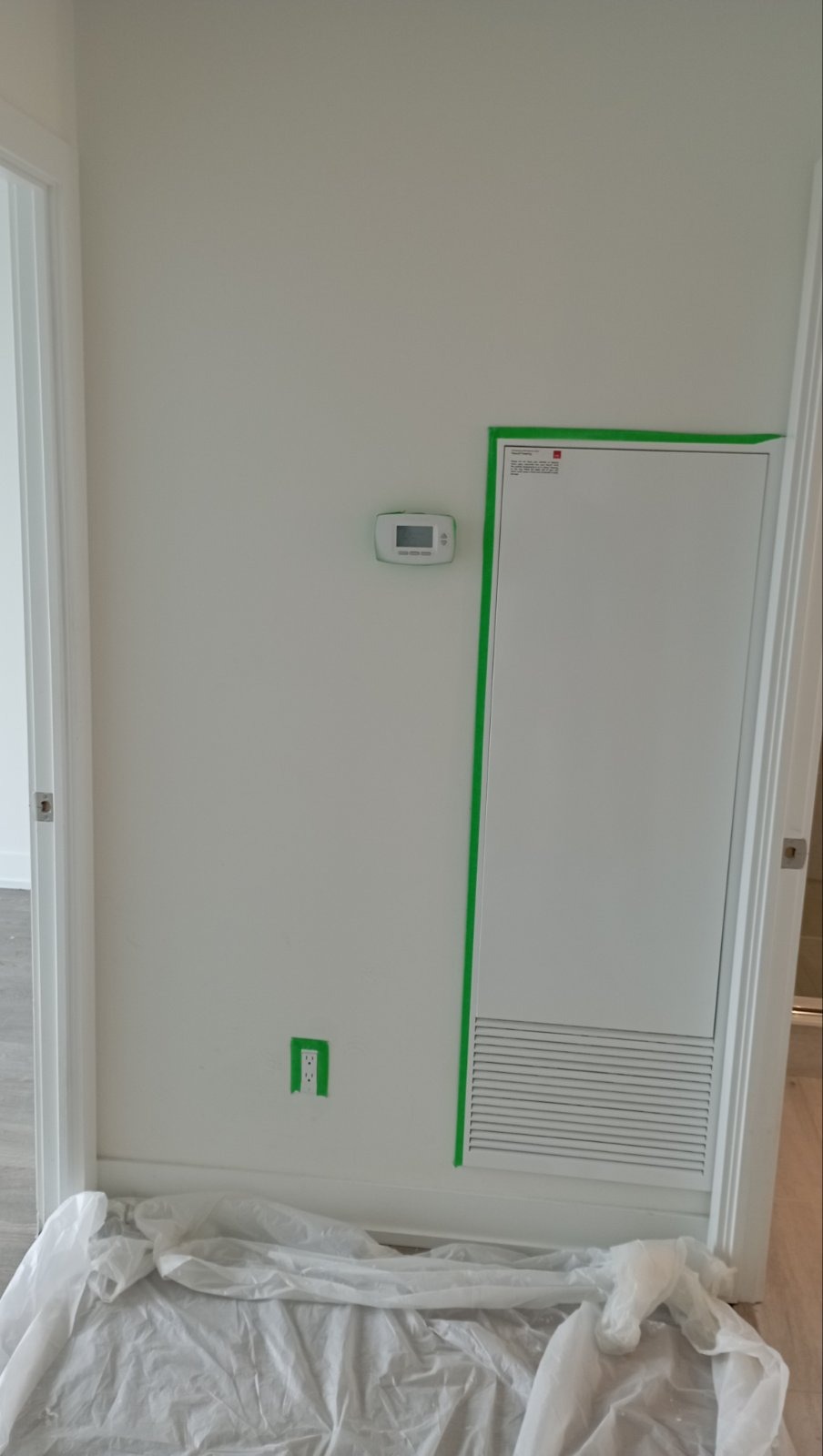 Wall vent and outlet masked off cleanly before painting